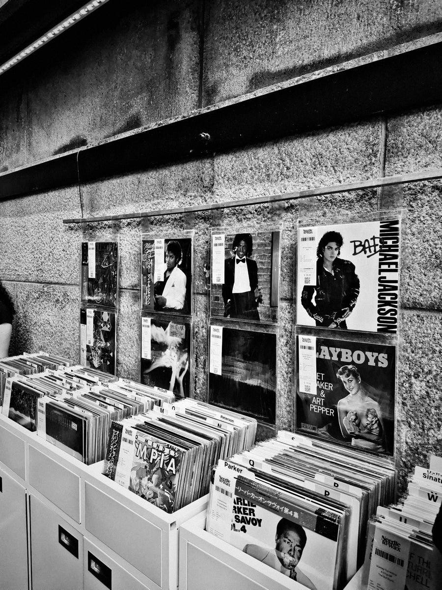 Wall display of records above the crates at the Needle to Wax stall in Dumbo