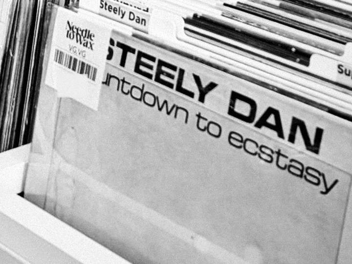 A graded record in a Needle to Wax crate